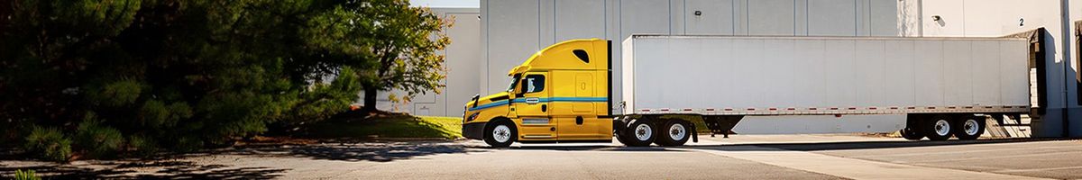 Penske tractor trailer at a loading dock